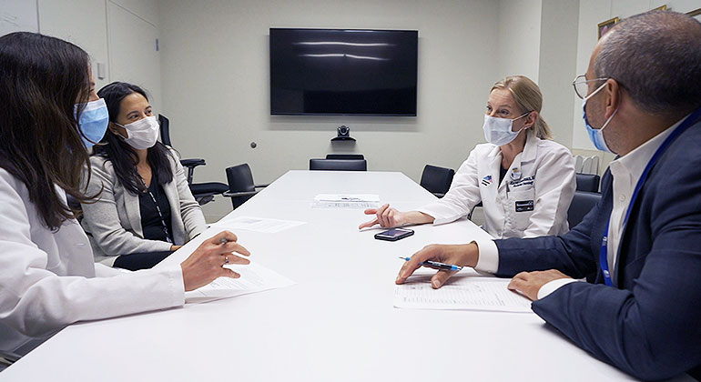 medical professionals at a conference table